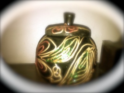 Pretty ceramic jar with Malaysian floral design.