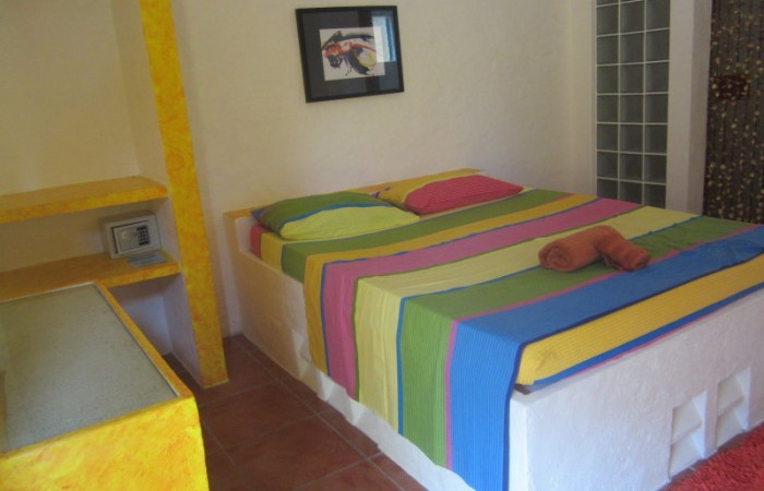 Kokay's colorful bed textiles inside Manta Room.